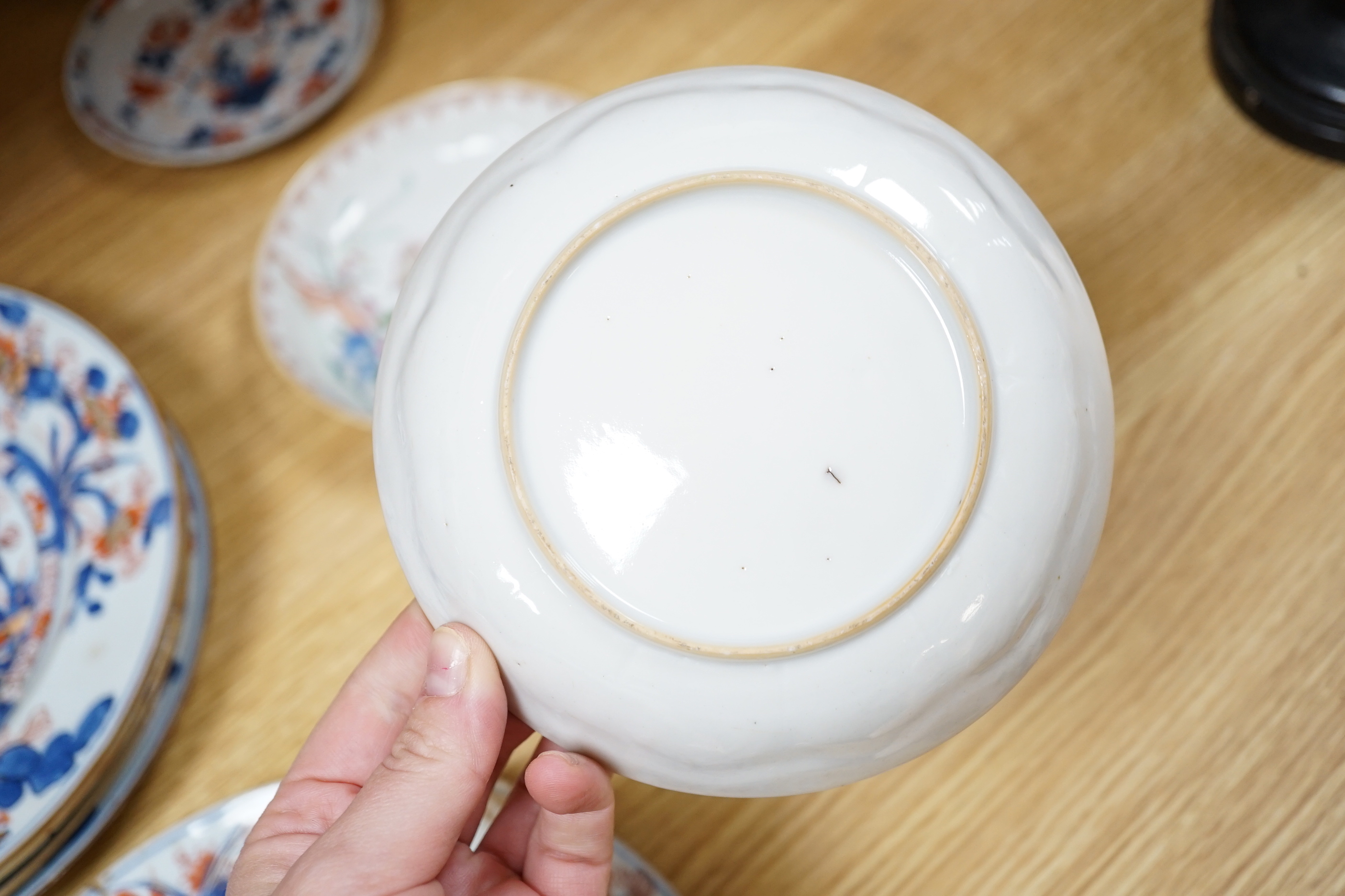 A collection of 18th century Chinese export plates and saucers